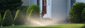 Automatic Sprinkler on the Front Lawn of a House