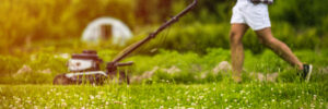 man mowing lawn in the Fall